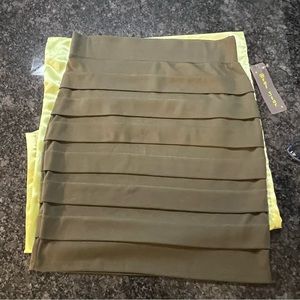 NWT. Olive Green Brat Star Bandage Skirt with sewn in horizontal pleats.